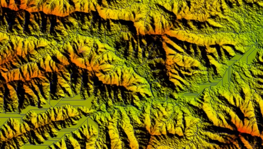 Réseau hydrographique tracé en bleu sur un modèle numérique de terrain ombré et coloré